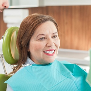 Woman smiling at the dental chair