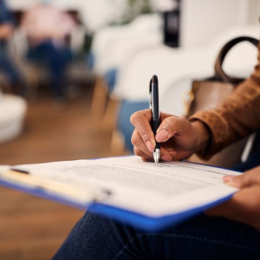 Patient filling out forms in lobby